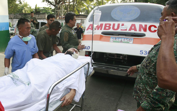 Swiss man Lorenzo Vinciguerra arrives on a stretcher at a military hospital, following his rescue from Abu Sayyaf abductors, on the southern island of Jolo, Mindanao, on December 6, 2014. 