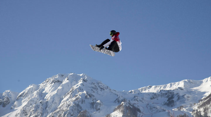 Canadian Mark McMorris flies through the air during a slopestyle snowboard training run at the Sochi Winter Olympics in Krasnaya Polyna, Russia, Wednesday, Feb. 5, 2014. 