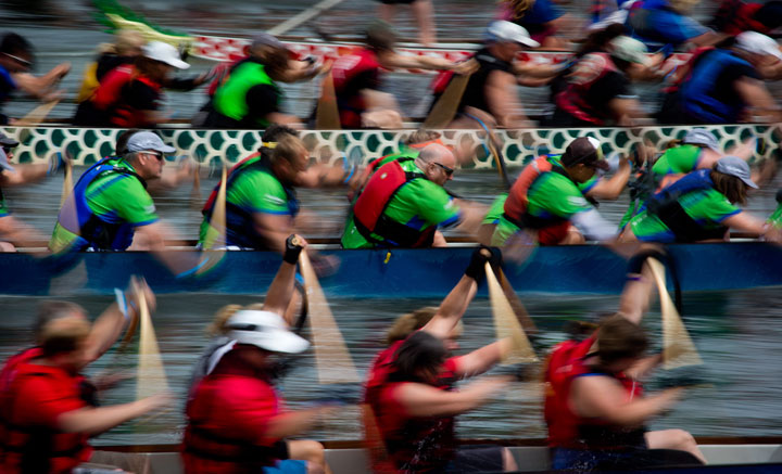 Competitors race during the Rio Tinto Alcan Dragon Boat Festival on False Creek in Vancouver, B.C., on Sunday June 22, 2014. 