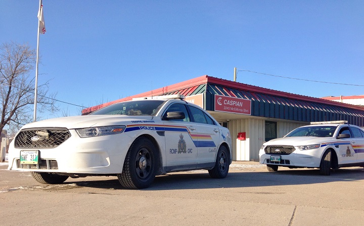 RCMP cruisers parked in front of Caspian Projects at 2245 McGillivray Boulevard in 2014.