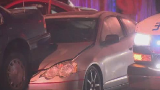 Two people injured after driver slams into parked cars - image