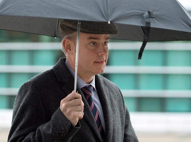 Dennis Oland, charged with second-degree murder in the death of his father, arrives at his preliminary hearing at the Law Courts in Saint John on Dec. 12, 2014.