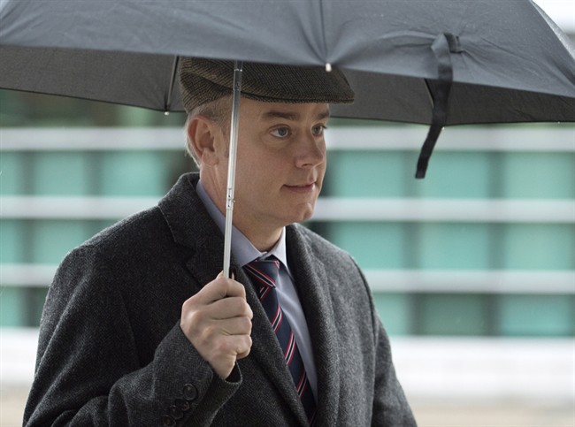 Dennis Oland, charged with second-degree murder in the death of his father, arrives at his preliminary hearing at the Law Courts in Saint John on Dec. 12, 2014.