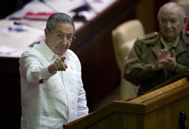 Cuba's President Raul Castro points to the press during the closing of the twice-annual legislative session at the National Assembly in Havana, Cuba, Saturday, Dec. 20, 2014. While praising the historic agreement between Cuba and the U.S. to restore relations, Castro made it clear that the agreement only goes so far.