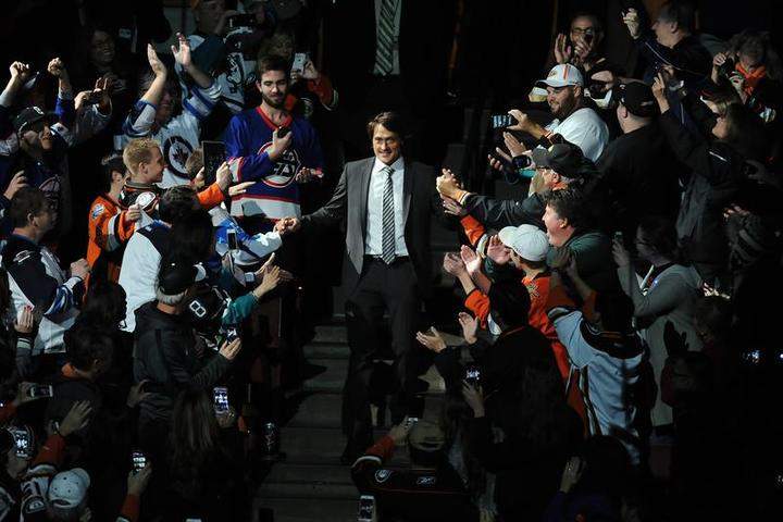 Teemu Selanne walks down the aisle as fans greet him during Teemu Tribute Night before the game between the Anaheim Ducks and the Winnipeg Jets on Sunday at Honda Center in Anaheim, Calif.