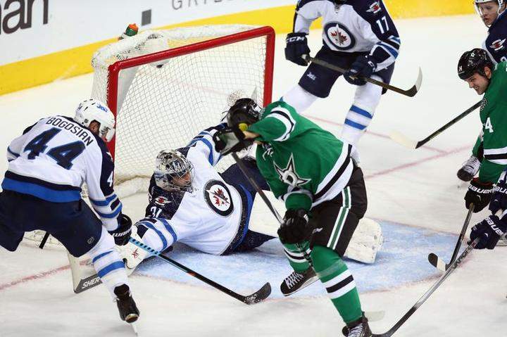 Ondrej Pavelec made 46 saves, including this one in front of Jason Spezza of the Dallas Stars in the third period, on Thursday in Dallas.