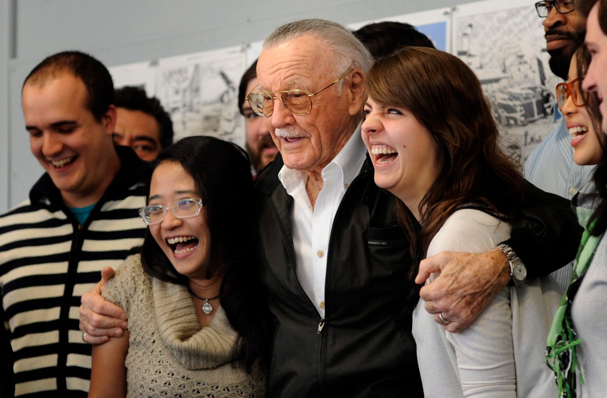 FILE: Legendary comic creator Stan Lee poses with students at the Savannah College of Art and Design .
