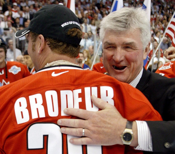 Team Canada coach Pat Quinn hugs goaltender Martin Brodeur after beating Team Finland 3-2 in the World Cup of Hockey final Tuesday, Sept. 14, 2004 in Toronto. 