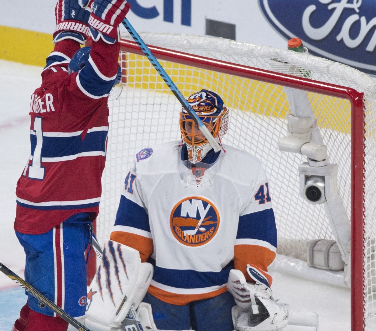 Montreal Canadiens' Brendan Gallagher after teammate Tomas Plekance (not shown) scores on New York Islanders goaltender Jaroslav Halak during second period/.