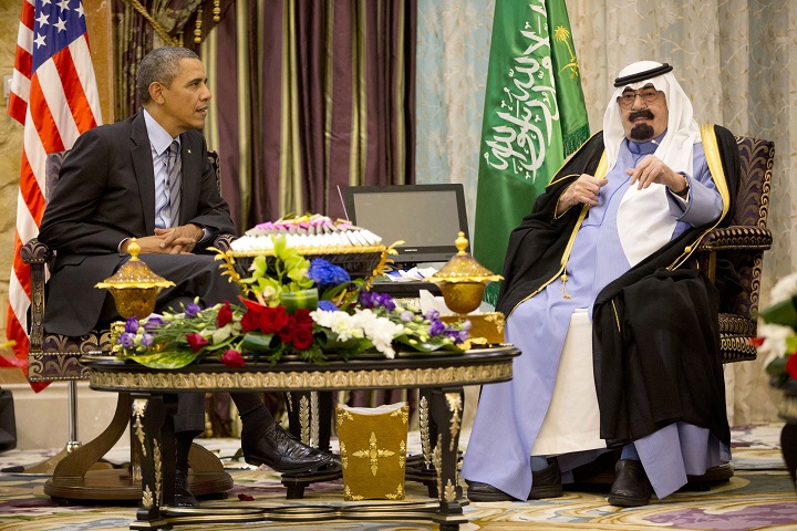 In this March 28, 2014 file photo, United States President Barack Obama meets with Saudi King Abdullah at Rawdat Khuraim, Saudi Arabia. Obama will cut short his three-day trip to India to travel to Saudi Arabia to pay respects following the death of King Abdullah, U.S. and Indian officials said Saturday.