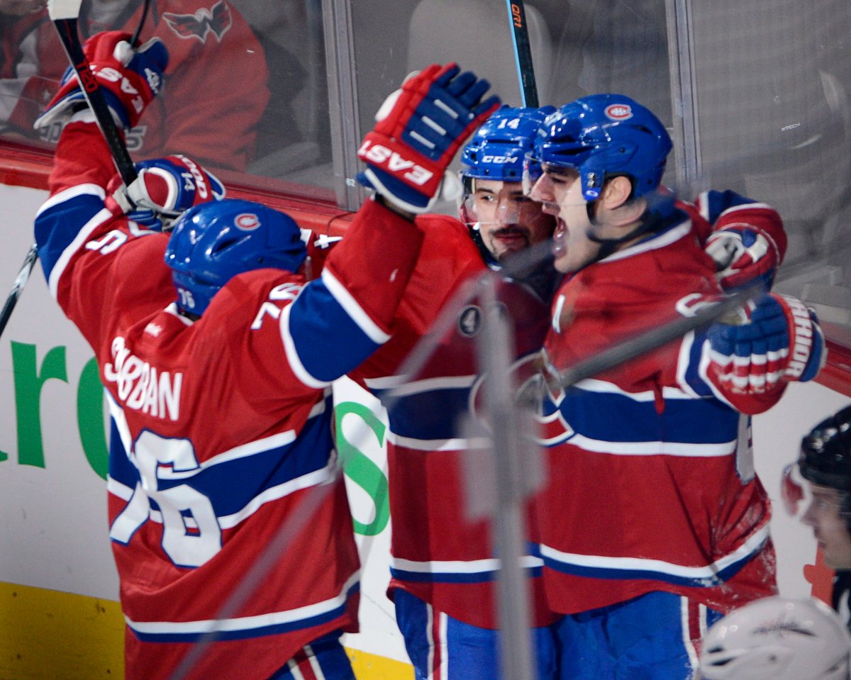 Montreal Canadiens left wing Max Pacioretty, right, celebrates with teammates P.K. Subban, left, and Tomas Plekanec after scoring the winning goal to defeat the Washington Capitals 1-0 during the overtime period of National Hockey League action in Montreal on Saturday, January 31, 2015.