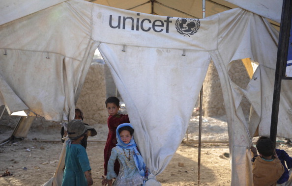 Children play in tents of UNICEF in Nasaji Bagrami District refugee camp in Kabul, Afghanistan on 13 June, 2014.