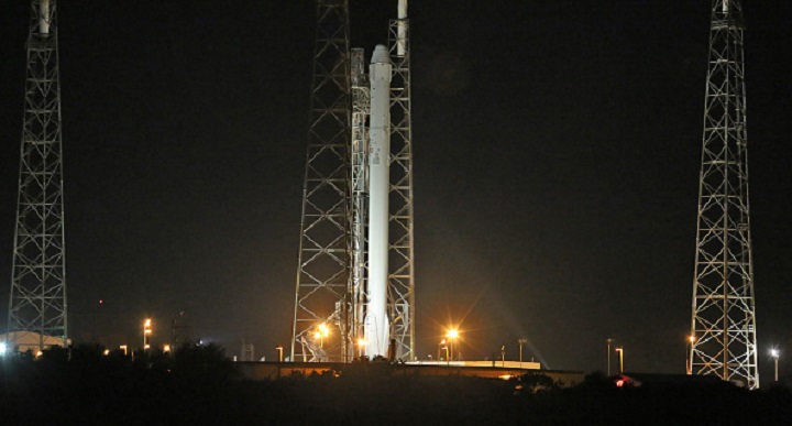 A SpaceX Falcon 9 rocket poised on Launch Pad 40 in Cape Canaveral, Fla., on Monday, Jan. 5, 2014, will launch the Dragon spacecraft early Tuesday to deliver supplies to the International Space Station. This will be SpaceX's fifth cargo delivery mission to the ISS. 