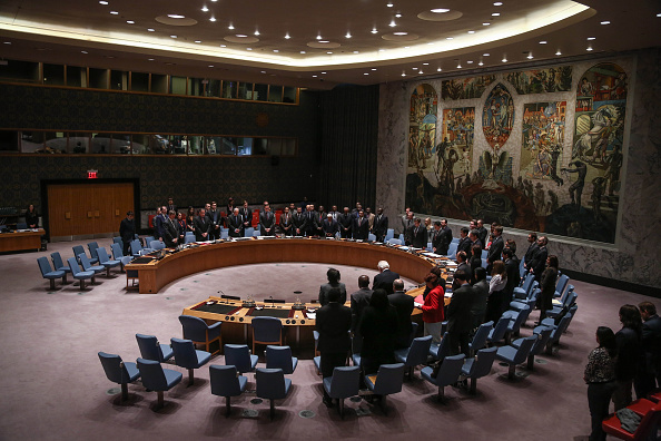 Members of United Nations Security Council stand in silence in respect for the victims of the attack on January 7 by armed gunmen on the offices of French satirical magazine Charlie Hebdo in Paris.