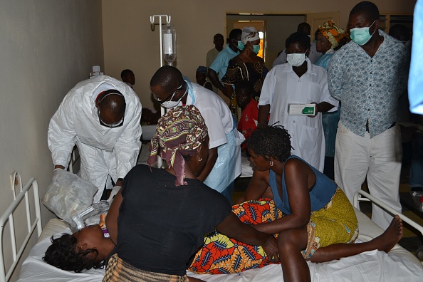 Mozambican doctors and nurses treat on January 11, 2015 a victim of alcohol poisoning at the Chitima health center in Tete province.