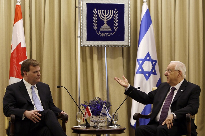 Israeli President Reuven Rivlin (R) talks with Canada's Foreign Minister John Baird (L) during their meeting at the presidential compound in Jerusalem on January 18, 2015. 