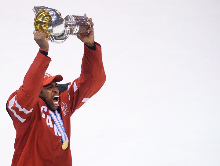 Canada forward Anthony Duclair hoists the championship trophy after defeating Russia during third period gold medal hockey action at the IIHF World Junior Championships in Toronto on Monday, January 5, 2015.