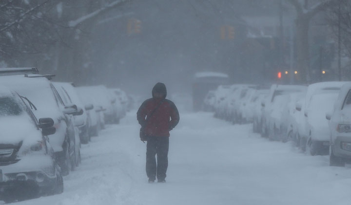 A man walks in the snow in Brooklyn, New York on Jan. 27, 2015.