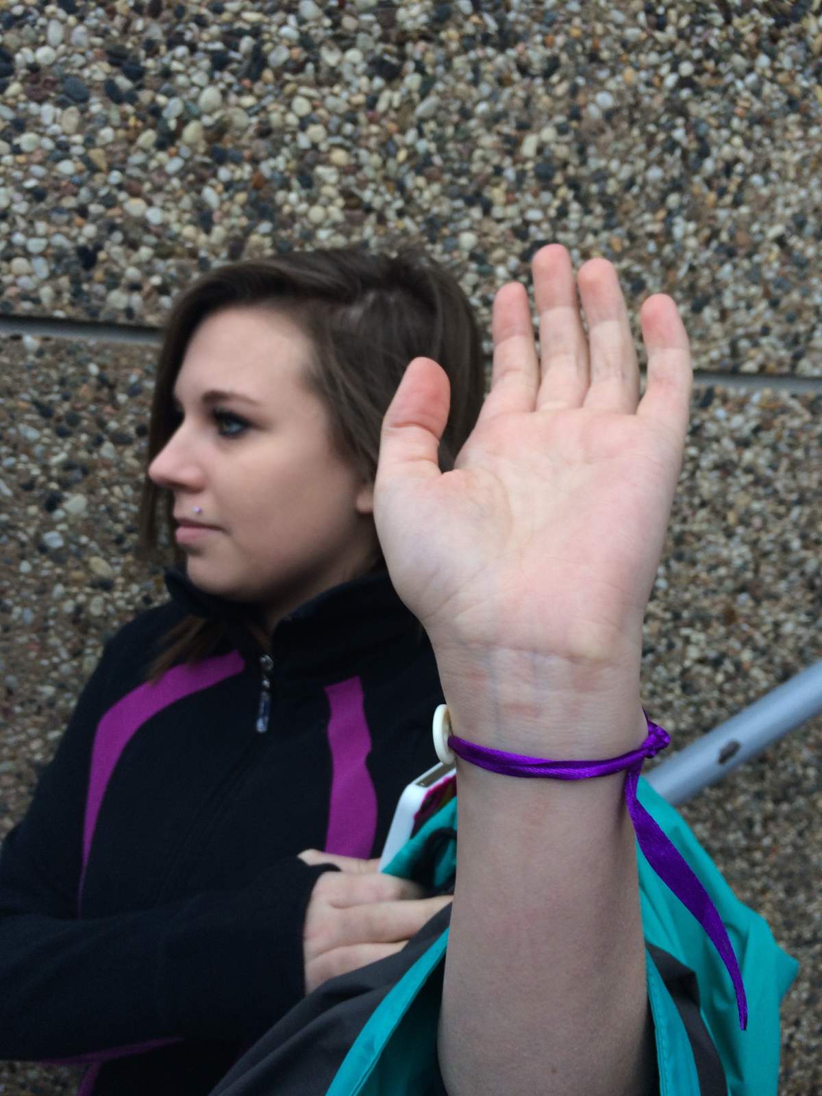 Tionna Ackerman shows one of the bracelets made in memory of Hannah Leflar.