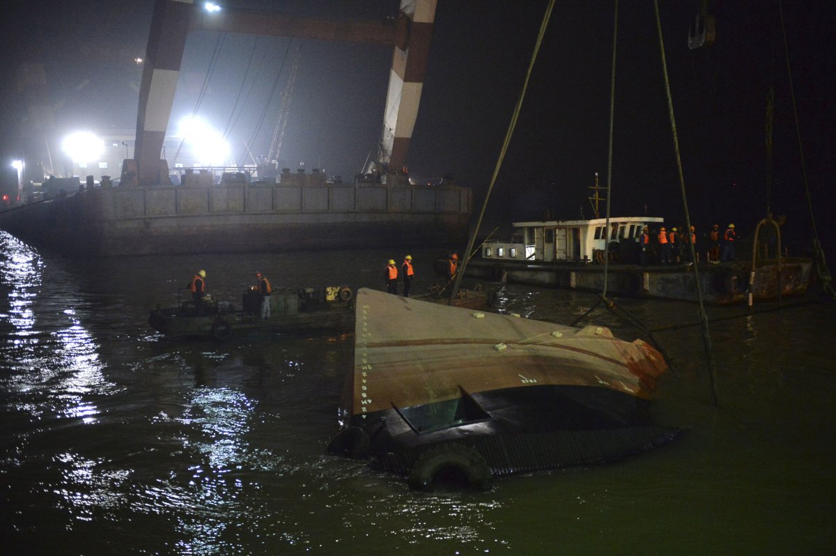 Rescuers salvage the wreck after a tugboat sank in the Yangtze River in China on Friday, Jan. 16, 2015. 