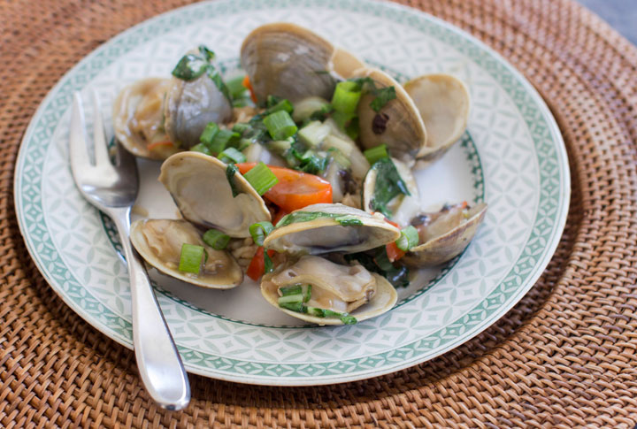 This Jan. 5, 2015, photo shows clams and bok choy with black bean sauce in Concord, N.H. Clams are lean and delicious source of protein and the automatic generator of a tasty, instant sauce.
