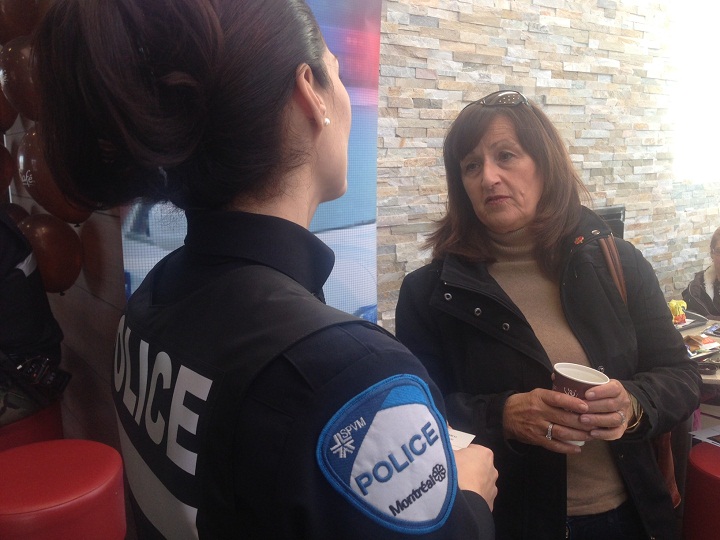 Police officers have coffee with residents.