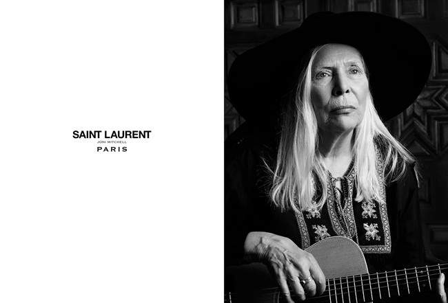 Joni Mitchell wears an Yves Saint Laurent folk tunic, a leather cape by designer Hedi Slimane and the Yves Saint Laurent classic fedora in this undated handout photo taken in Bel Air, California. Mitchell and Joan Didion are well into their golden years, but the music icon and literary legend have emerged as fashion's freshest faces.
