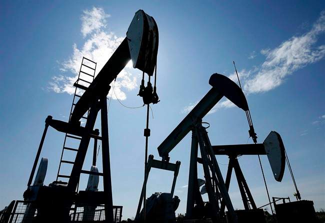 Pumpjacks at work pumping crude oil near Halkirk, Alta., June 20, 2007. THE CANADIAN PRESS/Larry MacDougal.