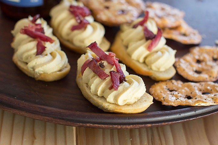 This Dec. 15, 2014 photo shows deviled egg toasts with country ham bits in Concord, N.H. The crunchy toast is a welcome contrast to the classic soft and unctuous deviled egg filling.