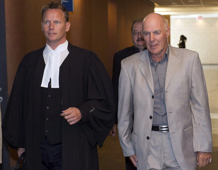 Former president of Quebec's FTQ labour union Jocelyn Dupuis , right, and his lawyer Jean-Daniel Debkoski leave the courtroom after being found guilty of fraud charges in Montreal on September 26, 2014. 