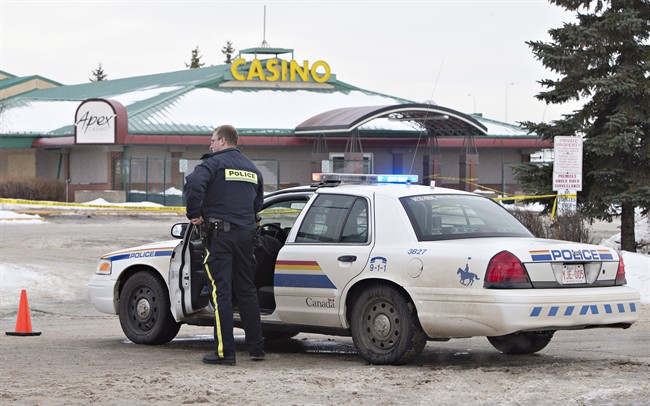 Police contain the scene where two RCMP officers were shot in St. Albert, Alta., on Saturday, January 17, 2015. 