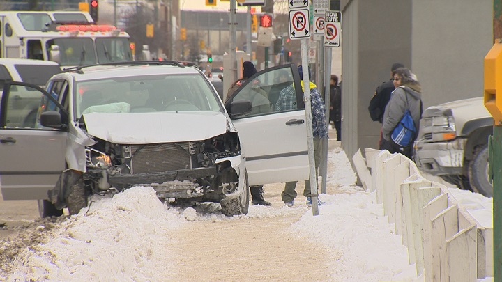 Minivan crashed in downtown Winnipeg following police chase on Friday, January 16, 2015.