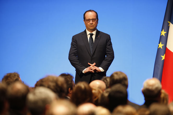 French President Francois Hollande pauses as he gives a speech as he attends the gala opening at the new Paris Philharmonie concert hall in Paris, Wednesday, Jan.14, 2015. 