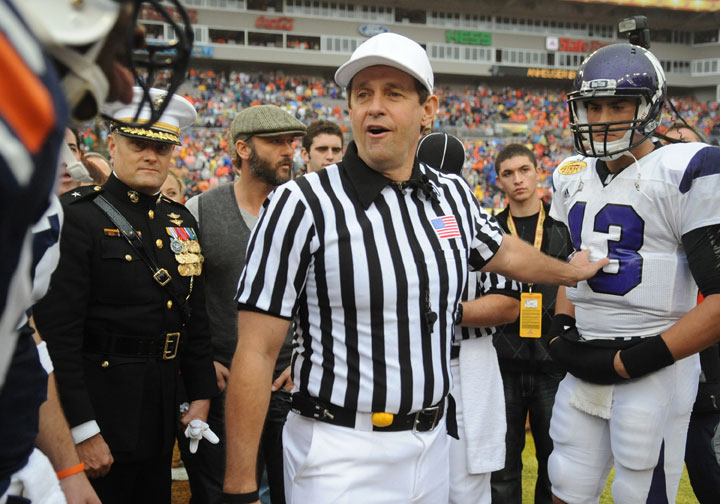 NCAA referee Greg Burks is seen during the coin toss before the Northwestern Wildcats play against the Auburn Tigers in the Outback Bowl January 1, 2010 at Raymond James Stadium in Tampa, Florida.  