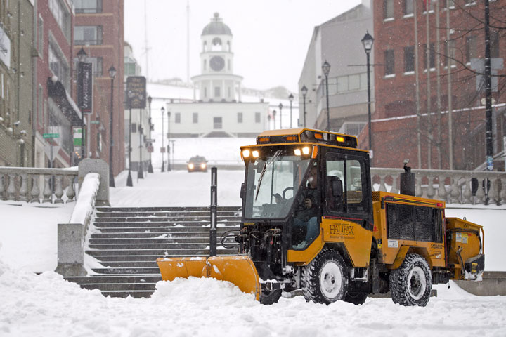 A plow clears the Grand Parade as a major winter storm hits Halifax on Jan. 27, 2015.