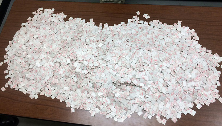 This photo taken Tuesday, Jan. 20, 2015, and provided by Delaware State Police, shows what they say are 15,000 packets heroin found in the car of Davon Tucker, of Paterson, N.J., during a traffic stop in Milton, Del.