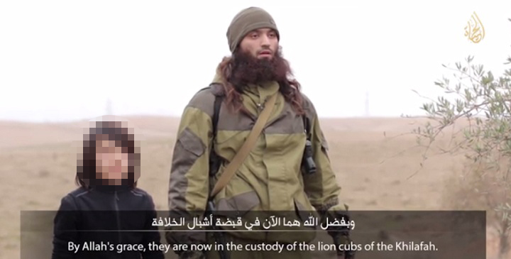 A young boy purportedly executed two alleged spies for Russia in a video released by ISIS on Tuesday.