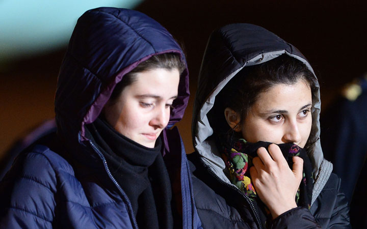 Italian aid workers abducted in Syria last summer, Greta Ramelli (L) and Vanessa Marzullo arrive at Ciampino airport in Rome early on January 16, 2015 after being freed a day earlier.