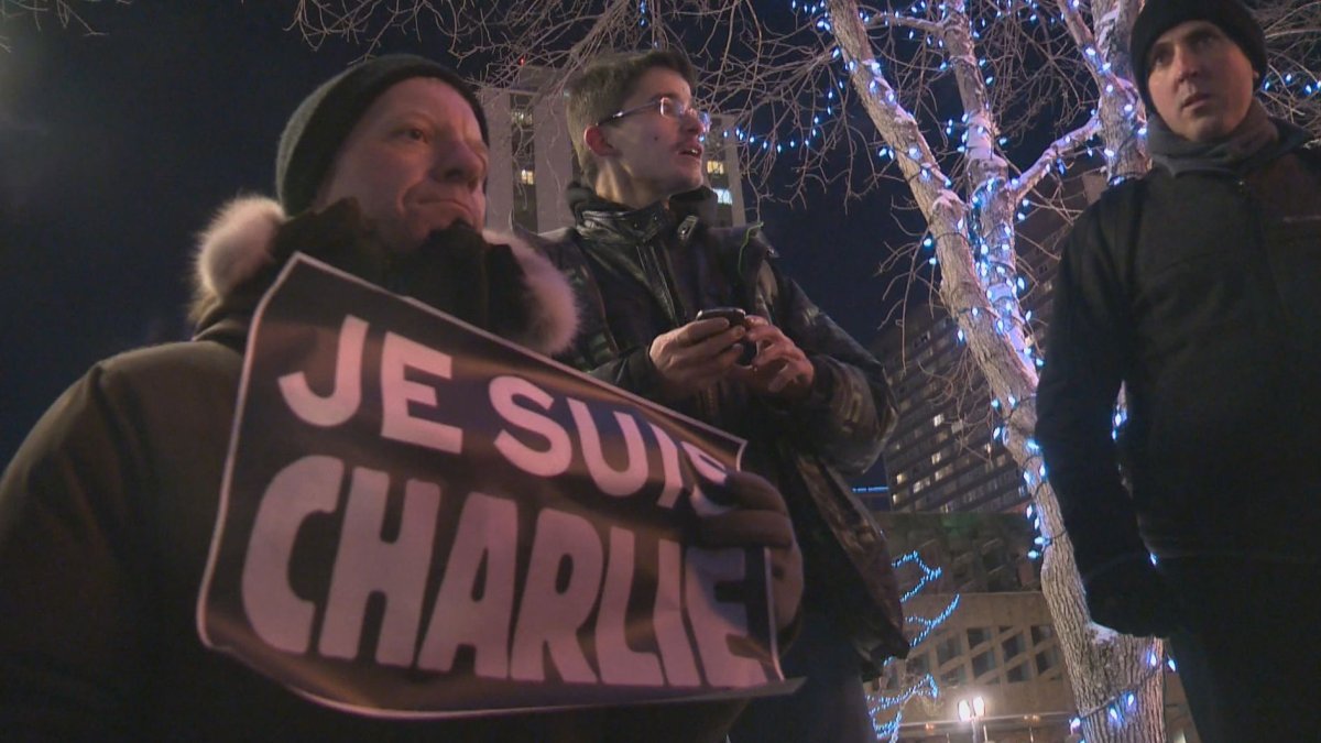 Edmonton residents hold a rally in support of the victims of the terror attacks in France, Sunday, Jan. 11, 2015. 