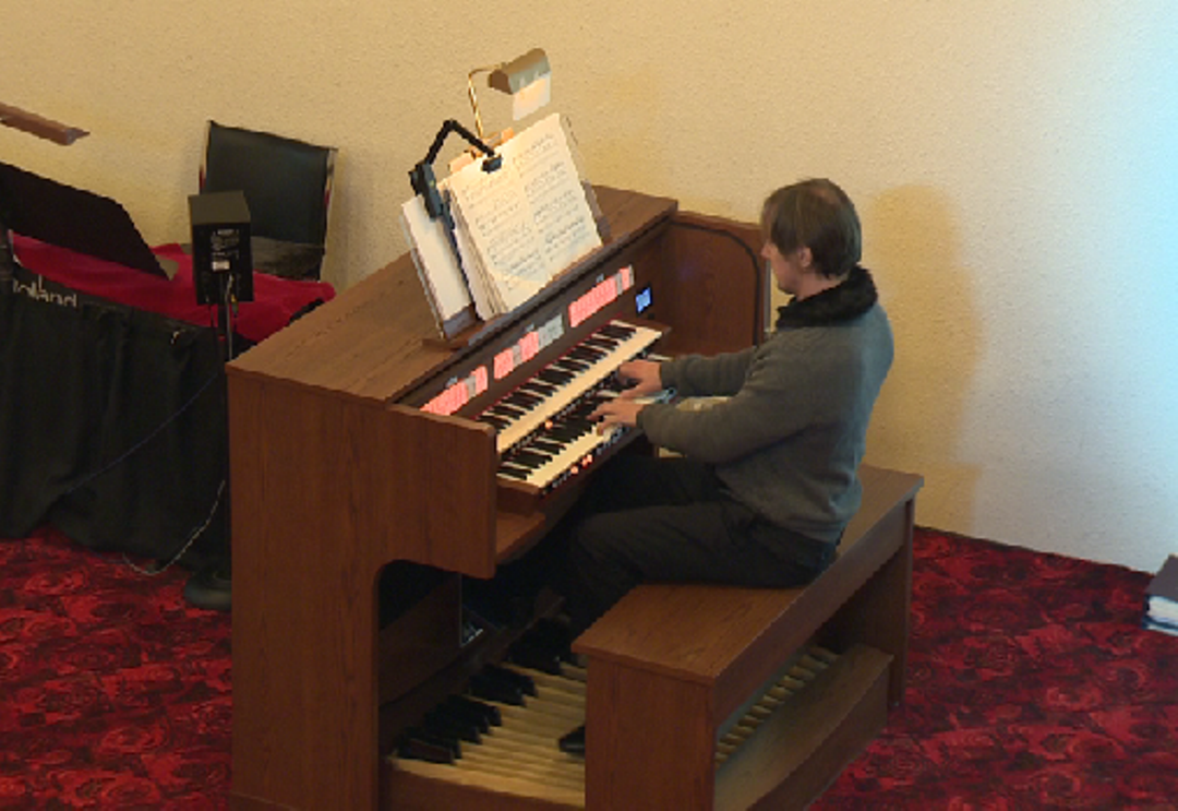 Steven LaPlanate plays the Rodgers Organ in preparation for his recital.