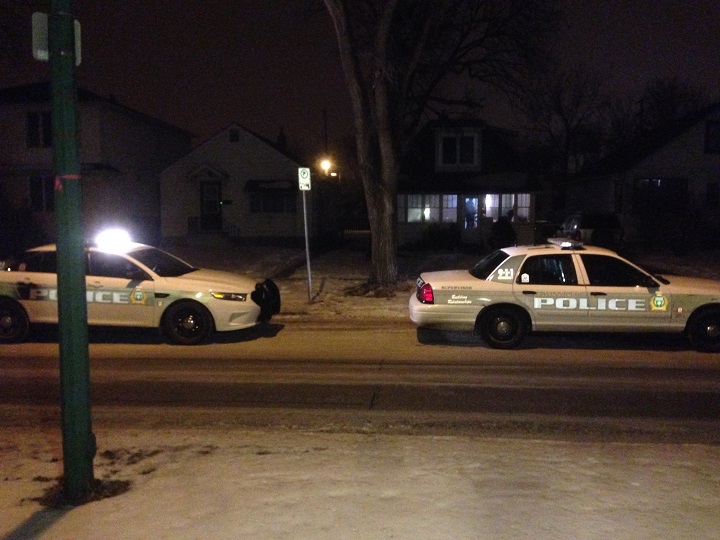 Police at scene of home invasion on McAdam Avenue in Winnipeg on Tuesday, January 27, 2014.