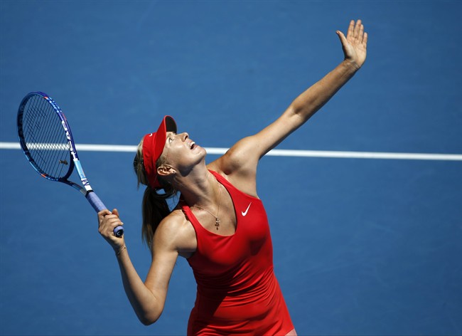 Maria Sharapova of Russia serves to her compatriot Ekaterina Makarova during their semifinal match at the Australian Open tennis championship in Melbourne, Australia, Thursday, Jan. 29, 2015. (AP Photo/Vincent Thian).