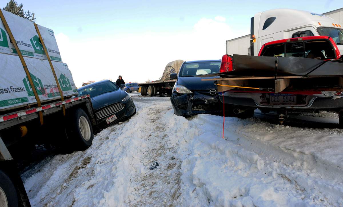 Cars and semi trucks on U.S. 23 after a massive pile up in York Township, Mich. Friday, Jan. 9, 2015.