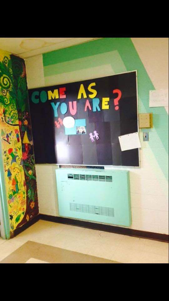 A painting on the wall of Onoway Junior-Senior High School depicting two young men kissing has been covered up.
