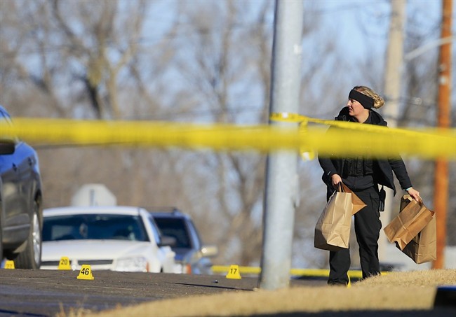 An investigator works the scene of a deadly shooting in Omaha, Nebraska on Saturday, Jan. 24, 2015.