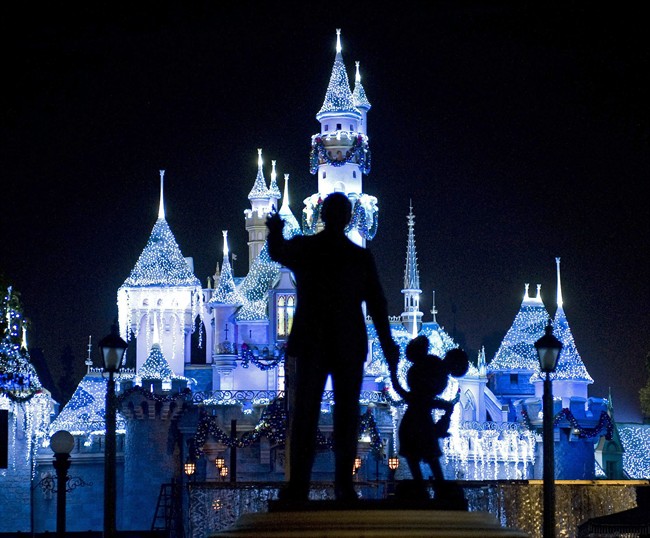 This Nov. 20, 2009 photo shows Sleeping Beauty's Castle in winter dress with the iconic "Partners" statue featuring images of Walt Disney and Mickey Mouse in the foreground, at Disneyland in Anaheim, Calif.