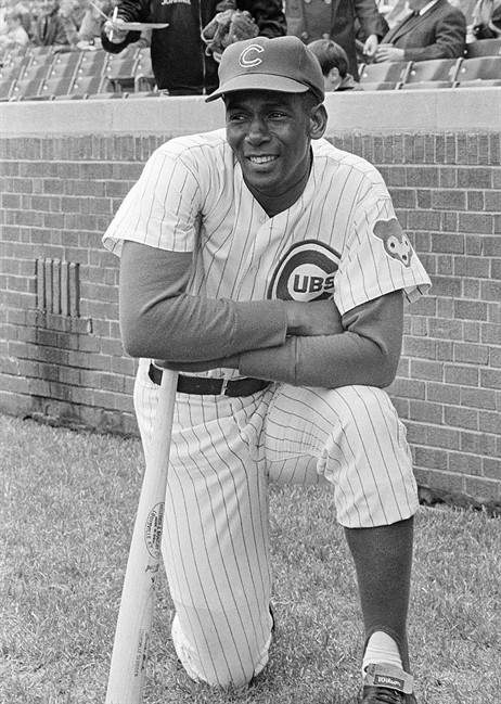 In this May 11, 1970, file photo, Chicago Cubs first baseman Ernie Banks looks toward the outfield fences of Wrigley Field in Chicago.