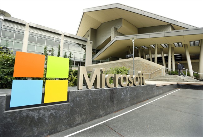 This July 3, 2014 file photo shows Microsoft Corp. signage outside the Microsoft Visitor Center in Redmond, Wash. 