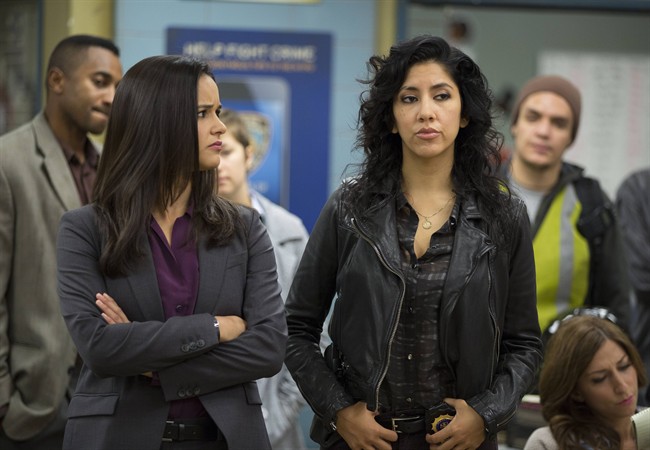 In this image released by Fox, Melissa Fumero, left, and Stephanie Beatriz appear in a scene from the comedy series, "Brooklyn Nine-Nine.".