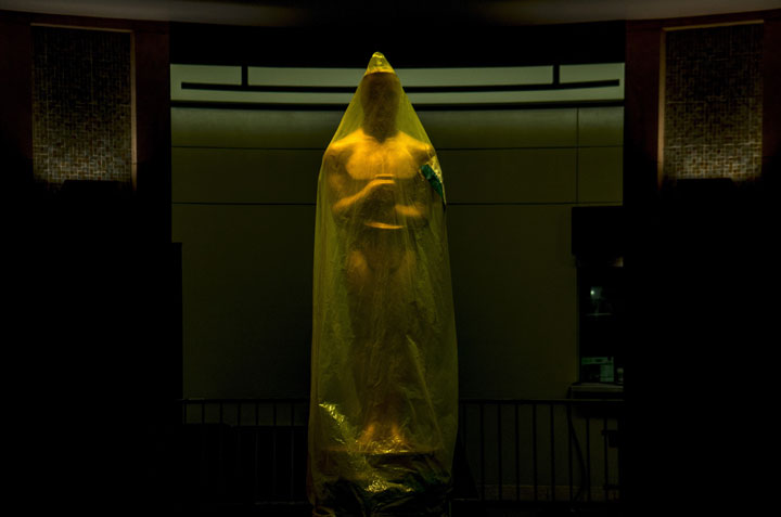 An Oscar statue stands covered prior to the 2014 Academy Awards ceremony.